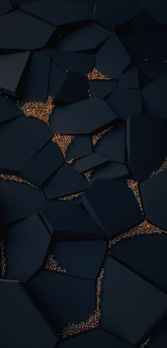 an abstract black and gold background with lots of small pieces of material in the shape of hexagons