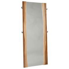 a tall wooden mirror hanging on the side of a wall