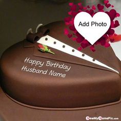 a happy birthday husband name cake with a knife on it's side and hearts in the background