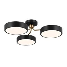 three lights that are on top of a ceiling fixture in an industrial style with black and gold trim