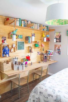 a bed room with a neatly made bed and wooden shelves