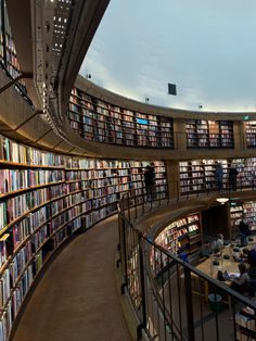 the inside of a library filled with lots of books