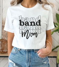 Band Mom Shirt, Marching Band Mom, Band Mom Life Tee, Drumline Mama, Gift for Band Mom, All About Halftime Shirt, Band Mama Shirt Bella Canvas 3001T:  T-Shirt Sizing Please reference the size chart before selecting shirt size.  Use one of your own t-shirts to measure the size and fit.  Then compare with the size chart provided to ensure an accurate fit. T-Shirt Materials 100% combed and ring-spun cotton. Heather colors are 90% combed and ring-spun cotton, 10% polyester. Pre-shrunk fabric. Should Mom Life Shirt Ideas, White Cotton Band Logo Top, White Cotton Top With Band Logo, Cotton Band Merch Tops With Lettering, White Cotton Shirt With Band Logo, White Cotton Shirt With Lettering, Band Mom Shirts Ideas, Marching Band Mom, Band Mom Shirts