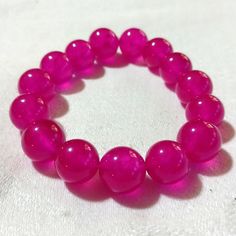 This Is A Stunning And Gorgeous Watermelon Tourmaline Bracelet. It Is Handmade And The Beads Are 15mm In Size, So They Are Big. They Are Translucent And Almost Glow In The Light. When You Hold Them To The Sunlight You Can Really See How Gorgeous They Are! This Is A Beautiful Bracelet For Anyone Who Likes Pink Or Magenta Colors. It Is Even Almost Purple In Color. I Hope You Like It. Thanks For Stopping By And Feel Free To Leave Me A Fair Offer. :) Spiritual Pink Round Stretch Bracelet, Pink Stretch Bracelet With Gemstone Beads, Raspberry Tart, Tourmaline Bracelet, Pink Jewelry, Watermelon Tourmaline, Crystal Bracelets, Neon Pink, Beautiful Bracelet