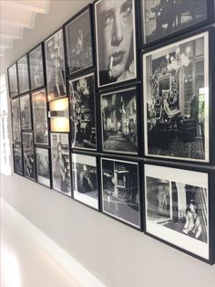 black and white photographs are hung on the wall