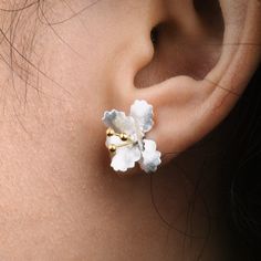 These delicate elegant floral stud earrings made by s925 sterling silver are inspired by our beautiful nature. This pair of fine earpieces is suitable for all casual and special occasions, such as weddings, parties, anniversaries, etc.  Materials:  Sterling Silver  Cyan Art Store creates dainty jewelry that is inspired by antique and tribal designs from around the globe.   All of our pieces are handmade so keep in mind that the final product might deviate slightly from the pictured product. Sterling Silver Birth Flower Earrings, Elegant Birth Flower Earrings, Delicate Sterling Silver Jewelry With 3d Flowers, Blossom Color Sterling Silver Flower Jewelry, Sterling Silver Jewelry With 3d Flowers, Blossom Colored Flower-shaped Sterling Silver Jewelry, Silver Single Flower Earring, Sterling Silver Flower Earring, Delicate Sterling Silver Birth Flower Earrings