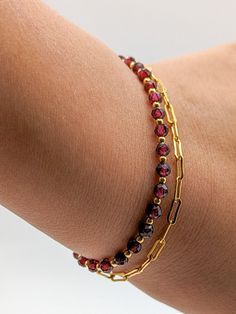 Absolutely stunning bracelet! Imagine two delicate chains, intertwined with natural garnet beads. These beads have a rich, deep color that catches the eye and adds a touch of luxury to your wrist. - Gold filled gold chain bracelet 15cm (+chain) - Natural garnet pearl - Gold filled GOLD spacer bead Wear it on a special night out to turn heads, or add a touch of glamor to your everyday outfit. Whatever the occasion, this bracelet will be your perfect companion, giving you glowing confidence with e Luxury Garnet Bracelets For Gift, Double Chain Bracelet, Gold Chain Bracelet, Gift For Woman, Double Chain, Gold Bracelet Chain, Everyday Outfit, Christmas Gifts For Women, Chain Link Bracelet