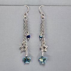 Star Earrings Dangle Drop Earrings Blue Glass Star Earrings Silver Star Charm Earrings Sterling Silver Plated Ear Wires Earrings These super fun three dangle drop earrings are so cute. The chain is stainless steel.  The star charm is silver plated.  They have a blue glass star and faceted glass beads. They are wire wrapped for added security. They will ship in an organza bag, perfect for gift giving. I am open to special requests.  Just send me a message. Blue Star Charm Drop Earrings, Blue Star Earrings With Star Charm, Blue Drop Earrings With Star Charm, Hypoallergenic Blue Star Earrings, Blue Star Charm Dangle Earrings, Blue Dangle Earrings With Star Charm, Blue Drop Earrings With Dangling Charms, Nickel-free Star-shaped Earrings For Jewelry Making, Blue Star-shaped Sterling Silver Earrings