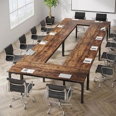 an empty conference room with tables and chairs