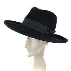 Man black fedora hat with large brim. You can choice between wool felt or rabbit fur felt with an elegant suede finish. Garnished with a black grosgrain ribbon of 4 centimeters wide. Elegant fedora for man and woman. The measurements in centimeters are 36 x 34. Brim length 9.5. (These measurements may vary slightly depending on the size of the hat) For its elaboration we only use hoods and capelines of resistant fur felt of very good quality. In our workshop in the Pyrenees we sew and make one b Elegant Black Fedora With Flat Crown, Black Flat Crown Fedora For Kentucky Derby, Black Fedora Felt Hat For Formal Occasions, Black Formal Fedora Felt Hat, Black Fitted Fedora With Flat Crown, Black Wool Fedora With Curved Brim, Black Wool Fedora With Flat Brim, Black Fur Felt Wide Brim Hat, Black Wide Brim Fur Felt Hat