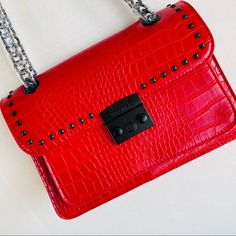 Badgley Mischka Crossbody/Shoulder Chain Red Vegan Leather Studded Embossed Croco Bag New With Tag Approx Measurement; Height: 7” Length: 9.80” Width: 3.25” Luxury Red Bag With Chain Detail, Red Evening Shoulder Bag With Chain Strap, Trendy Red Shoulder Bag With Chain Strap, Red Evening Bag With Chain, Chic Red Shoulder Bag With Chain Strap, Red Chain Shoulder Bag Rectangular, Elegant Red Shoulder Bag With Chain Strap, Shoulder Chain, Badgley Mischka