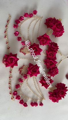 red roses and pearls are arranged on a white tablecloth with the words happy valentine's day