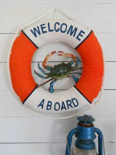 a life preserver with a crab on it and the words welcome to aboard