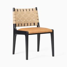 a wooden chair with black legs and a tan seat pad on the back of it