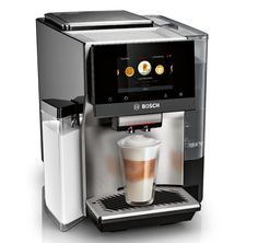 an espresso machine with a cup of coffee on the front and bottom panel