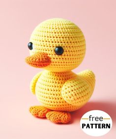 a crocheted yellow duck sitting on top of a pink surface with the words free pattern below it