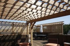 a wooden deck with chairs and an umbrella