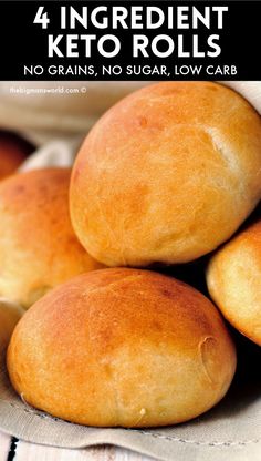 several round bread rolls stacked on top of each other in a pile with linen napkins