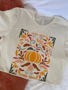 Aesthetic boho pumpkin graphic tee, super cute for your Fall photo ops! Pre shrunk 100% cotton shirt 50% Cotton / 50% Polyester Sweatshirts Washing Instructions:  Wash cold - inside out with like colors Do not bleach Dry on low or air dry Fall T Shirt Design Ideas, Fall Graphic Tees, Boho Pumpkin, Pumpkin Graphic, Pink Fall, Aesthetic Boho, Fall Graphic, Fall Photo, Thanksgiving Shirts