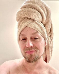 a man with a towel wrapped around his head