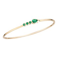 Meet your new favorite stacking bracelet! These slim but mighty gemstone bangles have a slight spring (aka FLEX 💪) to them, making them super easy to get on and off without getting bent out of shape. The combination of a single pear-shaped gemstone with three matching rounds add the perfect touch of chic. 14k yellow gold and emerald Emerald weight approx 0.80ct Length 7 inch (oval shaped) Bangle width 2mm Hook eye clasp Please allow 6-8 weeks for production if not in stockCustom lengths availab Gemstone Bangles, Gemstone Bangle, Out Of Shape, Jewelry Business, Sapphire Gemstone, Hook Eye, Bracelet Stack, 8 Weeks