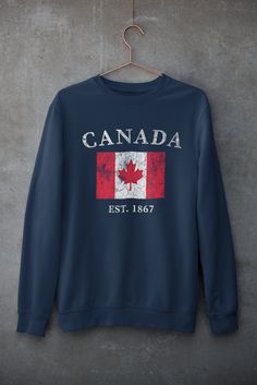 Canada Sweatshirt, Vintage Canada Gifts, Womens Canada Pullover, Mens Canada Vacation, Vintage Crewneck, Canada Souvenir, Canada Flag .: 50% Cotton 50% Polyester .: Medium-heavy fabric (8.0 oz/yd² (271.25 g/m .: Loose fit .: Sewn in label .: Runs true to size PROPER SIZING Please see photos to see a specific sizing chart for this shirt style. These shirts are unisex size, meaning they are not women's fitted shirts. If would like a more fitted look, we suggest that you size down. To get your size Fall Flag Print Crew Neck Sweater, Cotton Crew Neck Sweatshirt With Flag Print, Casual Long Sleeve T-shirt With Flag Print, Hoodies Canada, Canada Sweatshirt, Canada Hoodie, Canada Clothing, Canada Day Shirts, Canada Shirt