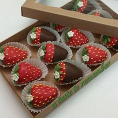 chocolate covered strawberries in a box on a table