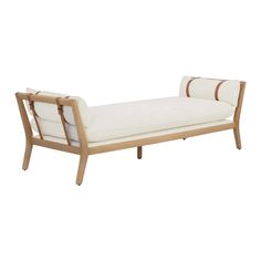 a white chaise lounge chair with brown straps