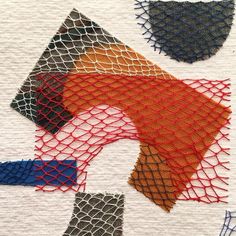 an art work with different colored lines and shapes on white paper that is stitched together