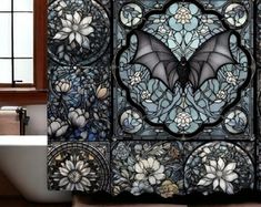 a bath tub sitting next to a window covered in stained glass flowers and bats on it