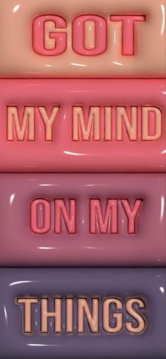 three different colored signs that say i got my mind on my things in pink and blue