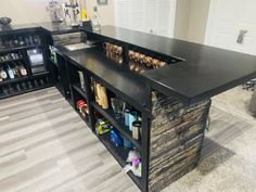 a kitchen with an island made out of wood