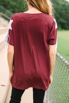 Well, howdy! If you are a Texas A&M we have the top for you! It's the perfect combination of comfy, spirited, and a definitely extra! We love the sequin varsity lettering but those sequin stars on the arms with that fringe!!! Girl! It's everything! Round neckline Short sleeves with sequin star appliques and fringe Sequin varsity lettering Fair stretch London is wearing the small. Red Sequin Top, Varsity Letter, Mint Julep Boutique, Maroon Red, Red Sequin, Mint Julep, Sequin Top, Measurement Length, Egift Card