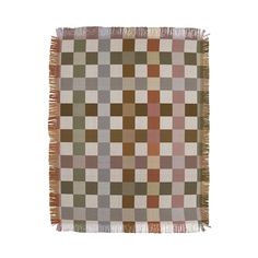 a multicolored checkered rug with fringes