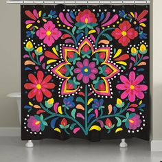 a black shower curtain with colorful flowers on it