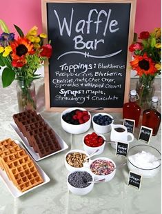 the waffle bar is ready to be served at your wedding or event with fresh fruit, yogurt and other toppings