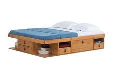 a bed with two drawers underneath it