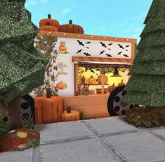 an animated image of a halloween shop with pumpkins and bats on the front window