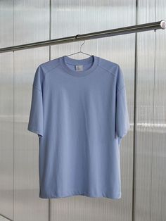 This essential sky blue t-shirt embodies casual comfort with its relaxed silhouette and breathable cotton fabric. The versatile loose fit design offers effortless styling possibilities, from laid-back weekend looks to casual office attire when layered under blazers. The classic crew neckline and clean-cut finish make this piece a timeless wardrobe staple that can transition seamlessly through seasons.Color: Sky Blue Casual Office Attire, Weekend Looks, Timeless Wardrobe, Timeless Wardrobe Staples, Office Attire, Casual Office, Blue T Shirt, Clean Cut, Blue Tshirt