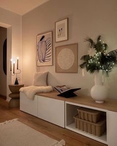 a living room filled with lots of furniture and christmas lights on the wall above it