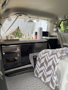 the interior of a camper van with lights on