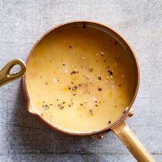 a pot filled with food sitting on top of a table