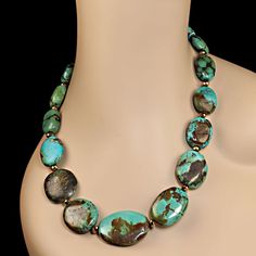 This is part of Chairish’s Fine Jewelry assortment.  Stunning 20-Inch Chinese Turquoise Necklace with Faceted Bronze Accents Elevate your fall wardrobe with this gorgeous 20-inch Chinese turquoise necklace, featuring striking oval flat turquoise nuggets that graduate in size from 20x17mm to 38x21mm. These stunning turquoise stones are beautifully accented with faceted bronze beads, adding a touch of warmth and elegance to the bold turquoise hues.  Key Features: Exquisite Chinese Turquoise: These Turquoise Oval Natural Stones Necklaces, Oval Turquoise Natural Stone Necklaces, Oval Turquoise Necklaces With Natural Stones, Turquoise Oval Necklaces With Natural Stones, Turquoise Necklaces With Oval Natural Stones, Oval Chrysocolla Necklace With Natural Stones, Elegant Oval Chrysocolla Necklace, Silver Ball Necklace, Nugget Necklace