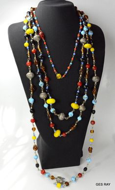 "It is a antique / vintage necklace made of semiprecious hand blown poured glass beds. The necklace contains 4 chains and the shortest one is 22\" long around the neck with a J shaped hook. It weighs about 9.8 oz.The longest chain hangs down for about 18\".Very nice and rare piece ! It is vintage item in good condition. Please see enlarged pictures for a detailed view. We posting new items every day ! Please, follow our store, if you like it, we post new items every day. Please, contact us with Vintage Czech Glass Polished Beads Necklace, Vintage Czech Glass Necklaces With Polished Beads, Vintage Czech Glass Necklace With Polished Beads, Vintage Necklace With Polished Beads, Vintage Multi-strand Beaded Necklace With Colorful Beads, Vintage Multi-strand Beaded Necklace With Polished Beads, Vintage Multi-strand Beaded Necklaces With Colorful Beads, Vintage Multi-strand Colorful Beaded Necklaces, Vintage Multicolor Necklaces With Colorful Beads