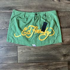 Condition: Brand New With Tags Size: Large Details: Mini Skirt From Ed Hardy. Comes In A Lightweight Cargo Like Material. Green Colorway. Classic Ed Hardy Font Printed On The Front In Gold. Back Has Large Lks Print. Smoke And Pet Free Home, Open To Offers, Feel Free To Ask Questions! Everything 100 Percent Authentic Guaranteed! Love Kills Slowly, Love Kills, Print Fonts, Ed Hardy, Green Skirt, 100 Percent, Mini Skirt, Womens Skirt, Mini Skirts