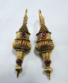 Gold earrings , vintage antique 22 k solid gold and natural Ruby set earrings dangles. Beautiful detailed workmanship pair in very good condition. Length-5.3 cm, weight -12.340 grams, material-22 K solid gold and natural Ruby gemstones. Antique Yellow Gold Ceremonial Earrings, Ceremonial Vintage Earrings With Intricate Design, Vintage Ceremonial Earrings With Intricate Design, Antique Dangle Earrings For Ceremonies, Antique Ceremonial Dangle Earrings, Antique Ceremonial Earrings For Pierced Ears, Antique Filigree Earrings For Ceremonial Occasions, Vintage 22k Gold Earrings, Antique 22k Yellow Gold Earrings