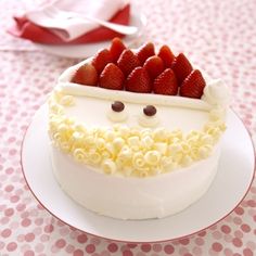 there is a cake with strawberries on it