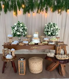 a table with desserts and flowers on it