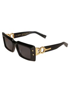 Lens color: grayFrame color: black and gold Luxury Shield Sunglasses With Polarized Lenses For Sports, Luxury Gold Shield Sunglasses For Women, Luxury Yellow Tinted Sunglasses, Luxury Designer Gold Sunglasses, Luxury Sleek Rectangular Shield Sunglasses, Black And Gold Sunglasses, Png Outfits, Black Gold Sunglasses, Balmain Blazer