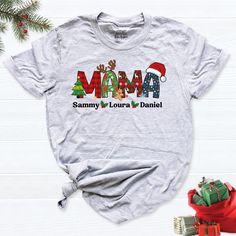 Personalized Christmas Mama Shirt with Kids Names, Custom Family Christmas Tee, Matching Holiday Shirts for Mom Kids, Cute Xmas Mama T-Shirt. Get ready for the holidays with our Personalized Christmas Mama Shirt with Kids' Names! This custom family Christmas tee is the perfect way to celebrate the season and show off your family pride. Whether you're matching with the kids for a family Christmas party or capturing those special holiday moments, this shirt is designed for moms who want to add a p Customizable Shirts, Family Christmas Party, Christmas Matching, Kids Names, Mama Gifts, Matching Tees, Holiday Wardrobe, Christmas Mom, Mom Kid